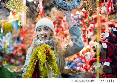 Cheerful positive girl in coat posing 26725414