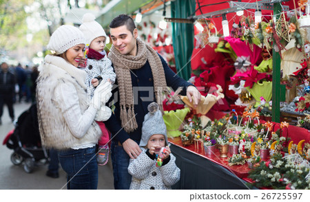 Happy family in Christmas fair 26725597