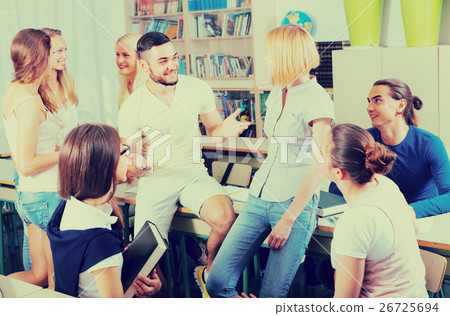 students chatting while sitting in the room students chatting while sitting in the room 26725694