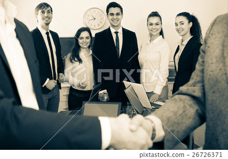 Business handshake at office meeting. Business handshake at office meeting. 26726371