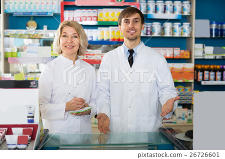 technicians working in chemist shop 26726601