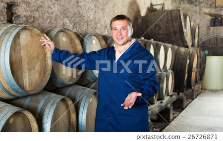 Man wine house technician working in storage Man wine house technician working in storage 26726871