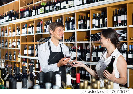 wine seller and customer in wine shop. wine seller and customer in wine shop. 26726925