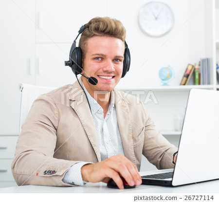 Young man working in call centre Young man working in call centre 26727114