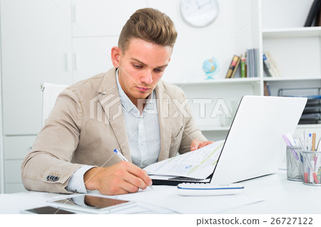 Frustrated manager doing paperwork at office. Frustrated manager doing paperwork at office. 26727122