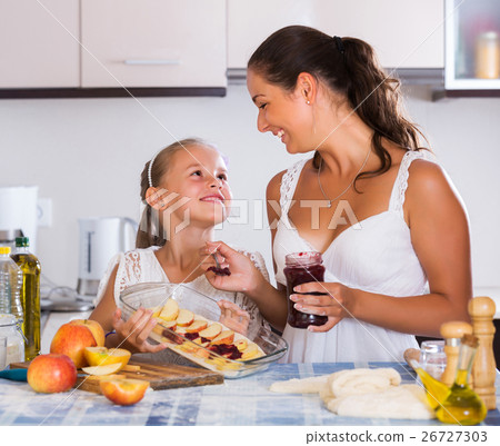Woman and child cooking strudel 26727303