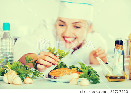 Professional chef decorating dish with salmon Professional chef decorating dish with salmon 26727320