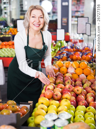Portrait of positive woman working in grocery Portrait of positive woman working in grocery 26727356