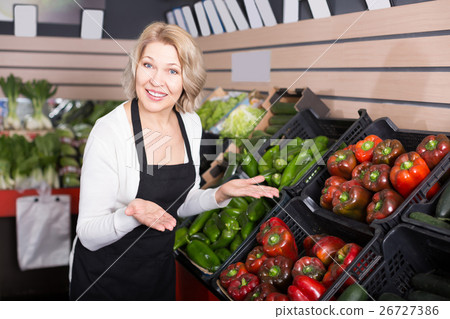 Portrait of happy woman working in grocery Portrait of happy woman working in grocery 26727386