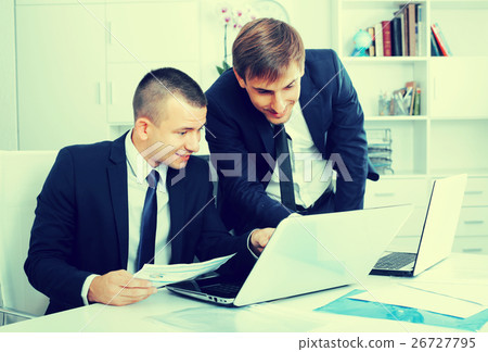 two young managers in office. 26727795