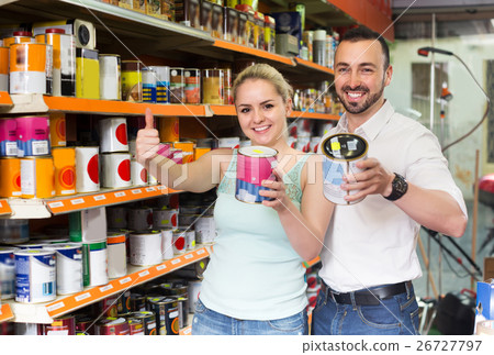 Couple discussing and selecting paint 26727797