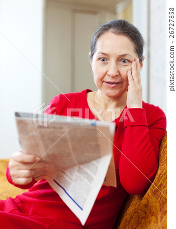 wonder grief woman with newspaper wonder grief woman with newspaper 26727858