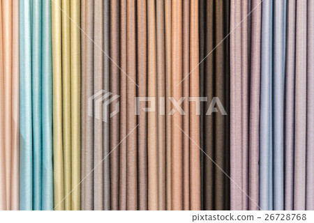 Colorful curtain samples hanging from hangers rail Colorful curtain samples hanging from hangers rail 26728768