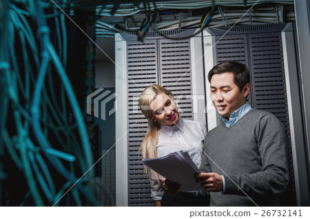 Young engineers businessmen in server room Young engineers businessmen in server room 26732141