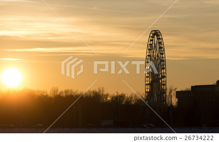 Silhouette of ferris wheel at sunset 26734222