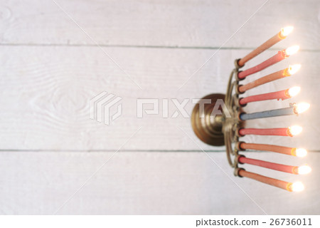 Hanukkah menorah with burning candles on table 26736011