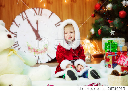 Little boy in a Christmas tree with gifts Little boy in a Christmas tree with gifts 26736015