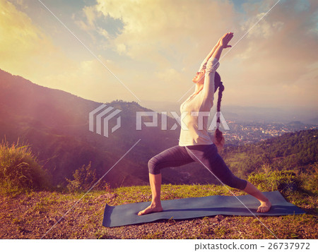 Woman doing yoga asana Virabhadrasana 1 - Warrior Woman doing yoga asana Virabhadrasana 1 - Warrior 26737972