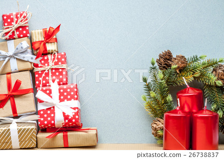 pile of christmas gifts and candles 26738837