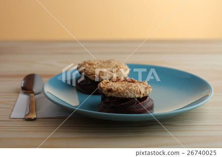 coconut cookies filled jam covered with chocolate coconut cookies filled jam covered with chocolate 26740025