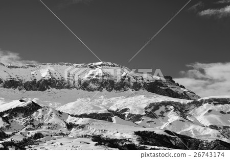 Black and white snowy mountains at sun winter day 26743174