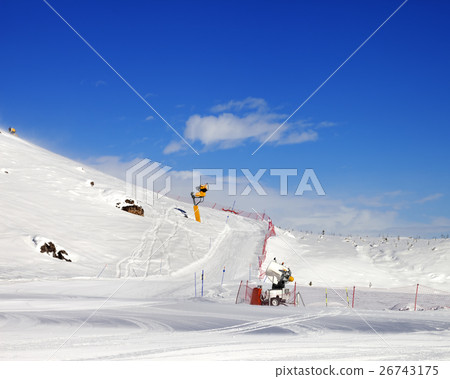 Ski slope with snowmaking at sun day 26743175