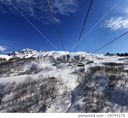 Chair-lift at ski resort in sun winter day 26743178