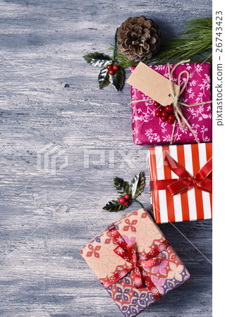 christmas gifts on a wooden surface christmas gifts on a wooden surface 26743423