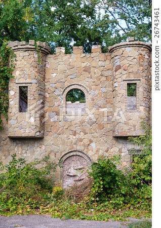 old overgrown with plants from the wild stone 26743461
