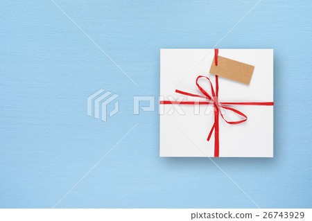 White gift box on blue table top view 26743929