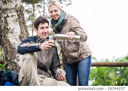 Wanderers found a place to rest under trees 26744257