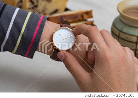 Girl's hand with wrist watches at the coffee break 26745105