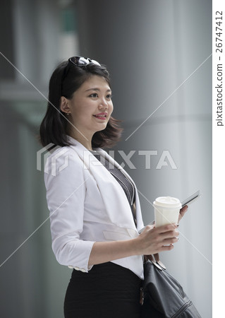 Portrait of a young asian business woman. Portrait of a young asian business woman. 26747412