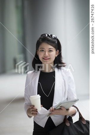 Portrait of a young asian business woman. Portrait of a young asian business woman. 26747416