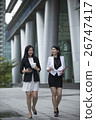 Two asian business woman talking outside. 26747417