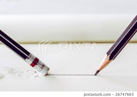 pencil draws a straight line on paper and pencil 26747663
