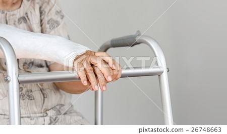 Elderly patient waiting on her walker 26748663