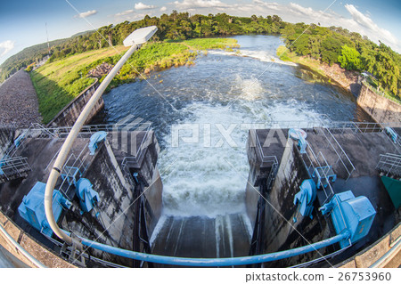 Water flowing from the open sluice gates of dam. 26753960