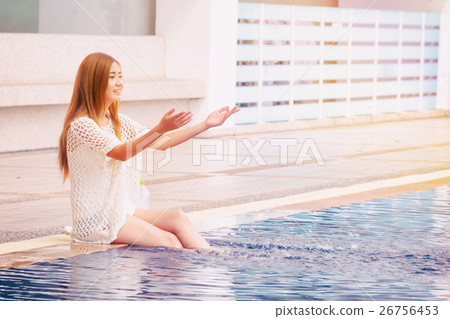 Young Asian woman sitting chill out at  pool 26756453