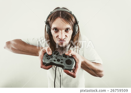 Stressed man playing on pad Stressed man playing on pad 26759509