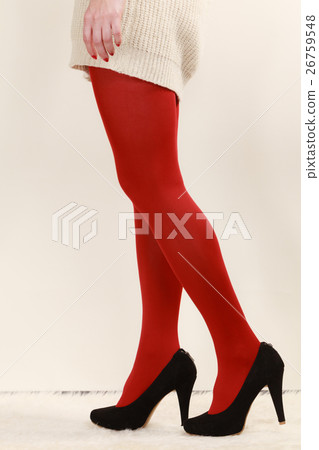 woman legs in red vivid color pantyhose black high heels shoes 26759548