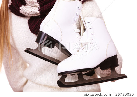 Woman with ice skates getting ready for ice skating Woman with ice skates getting ready for ice skating 26759859