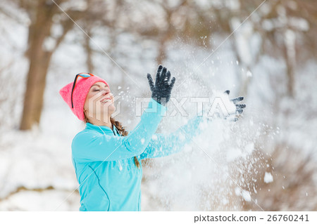 Girl tossing snow around 26760241