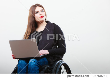 Disabled woman with laptop on wheelchair. Disabled woman with laptop on wheelchair. 26760262