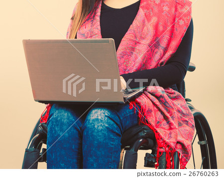 Disabled woman with laptop on wheelchair. Disabled woman with laptop on wheelchair. 26760263
