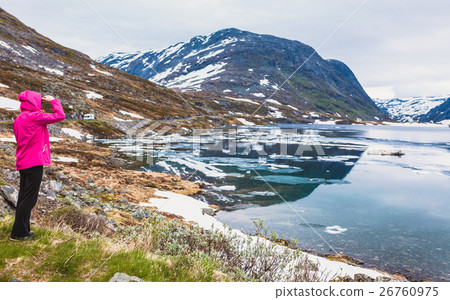 Tourist woman standing by Djupvatnet lake, Norway 26760975