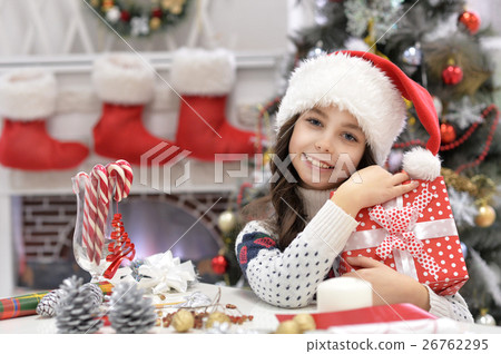 Girl with Christmas present Girl with Christmas present 26762295