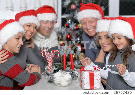 Family celebrating Christmas Family celebrating Christmas 26762420