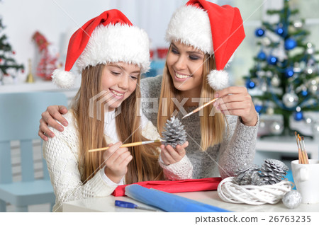 Sisters preparing for Christmas Sisters preparing for Christmas 26763235
