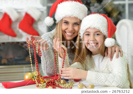 Sisters preparing for Christmas Sisters preparing for Christmas 26763252